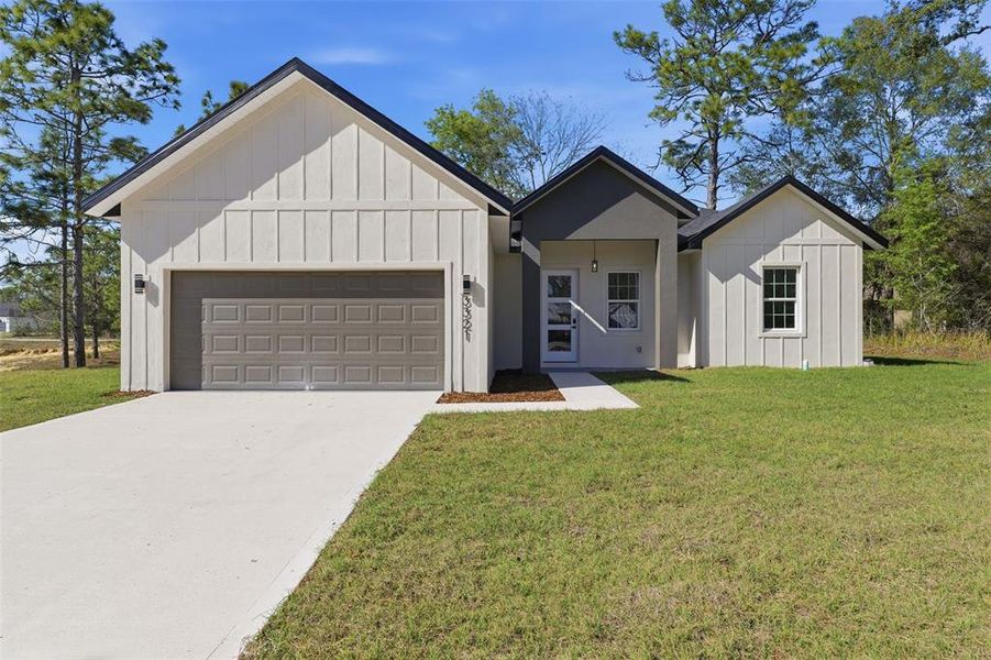 Front exterior of a new home in , Citrus Springs, FL, highlighting curb appeal (Image 17).