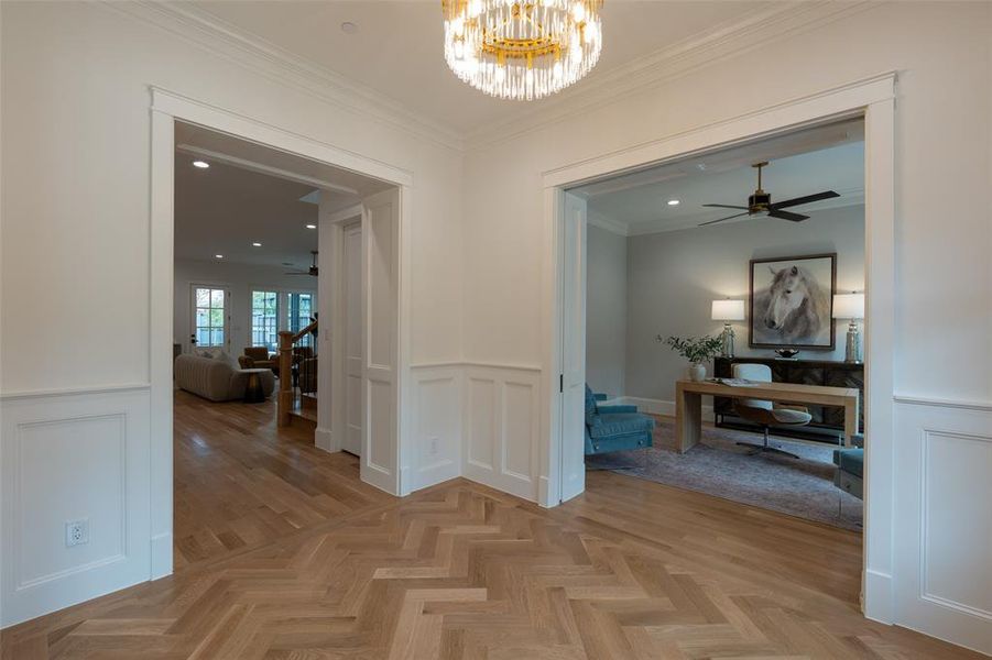 Entry foyer with custom chandelier.