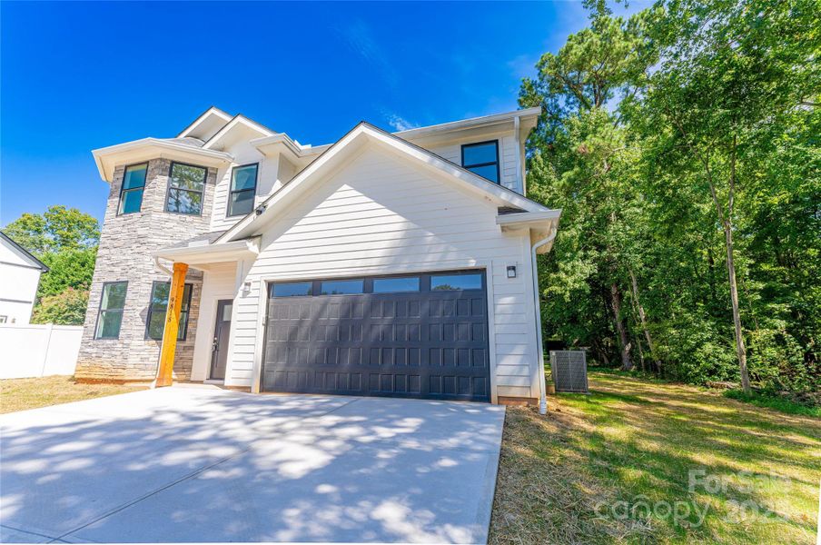 Front exterior of a new home in , Charlotte, NC, highlighting curb appeal (Image 2). Front exterior of a new home in , Charlotte, NC, highlighting curb appeal (Image 2).
