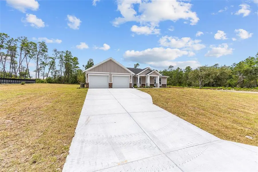 Front exterior of a new home in , Dunnellon, FL, highlighting curb appeal (Image 2). Front exterior of a new home in , Dunnellon, FL, highlighting curb appeal (Image 2).