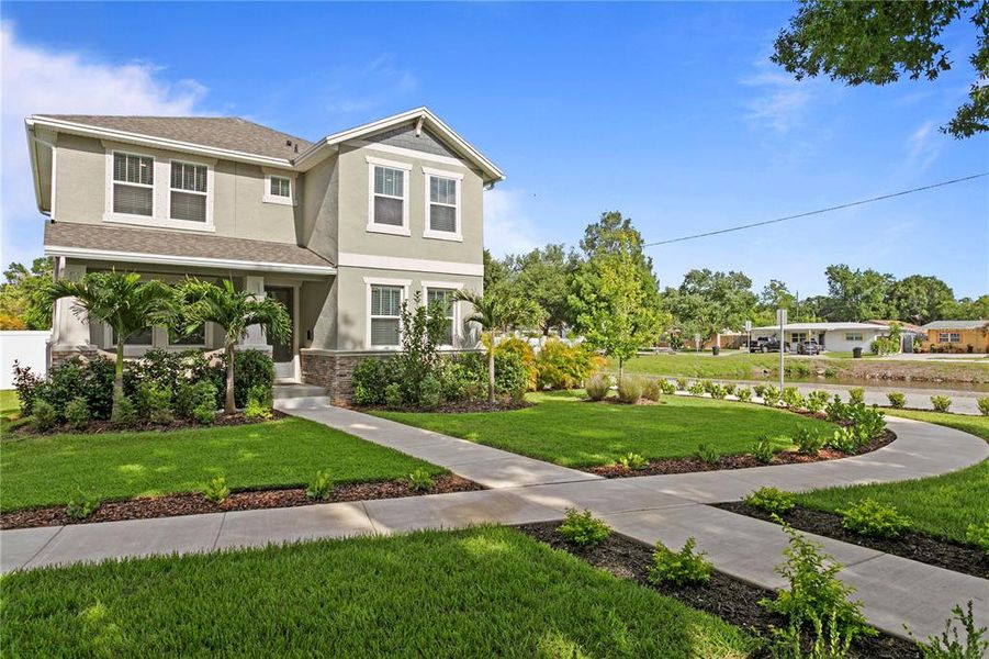 Front exterior of a new home in , St. Petersburg, FL, highlighting curb appeal (Image 26).