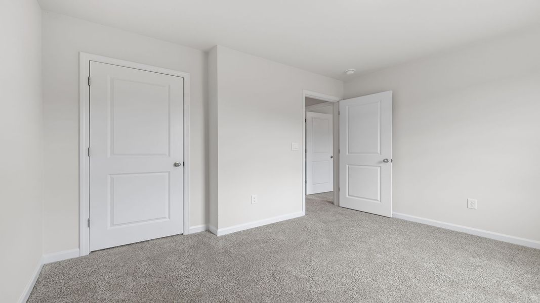 Spacious, unfurnished interior of a new home in Bentley Park, Greenwood (Image 24).