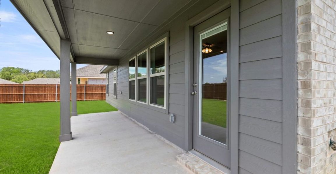 Representative exterior photo of a completed home built from the Lincoln by Impression Homes in Keeneland, Aubrey, TX (Image 27). Representative exterior photo of a completed home built from the Lincoln by Impression Homes in Keeneland, Aubrey, TX (Image 27).