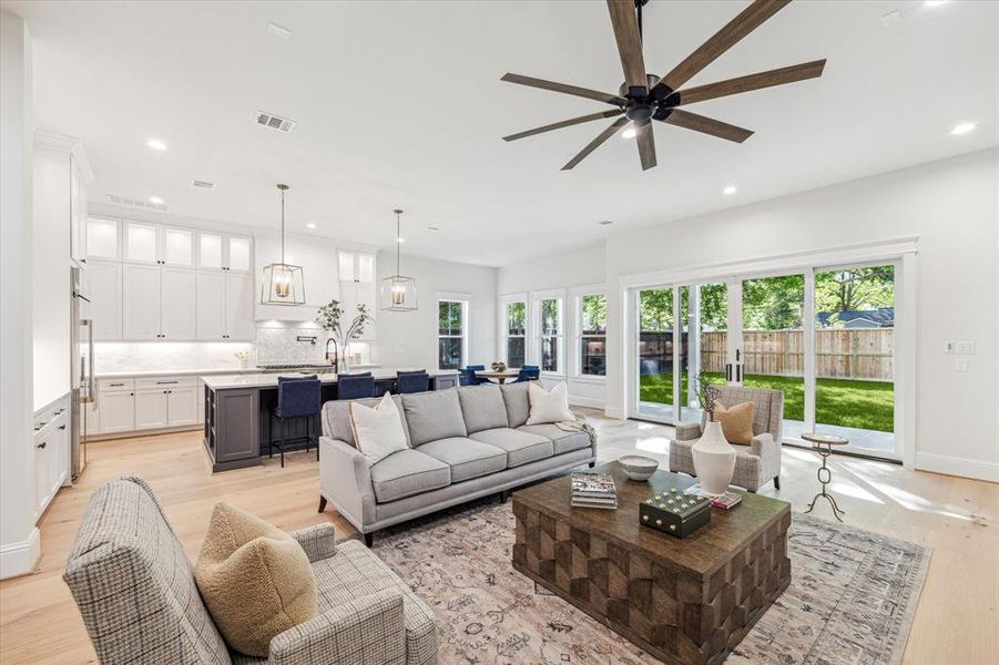 Custom sliding doors open up to the huge covered back patio