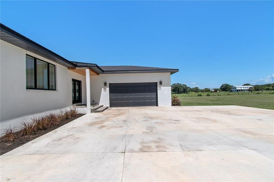 Front exterior of a new home in , Palmetto, FL, highlighting curb appeal (Image 2). Front exterior of a new home in , Palmetto, FL, highlighting curb appeal (Image 2).