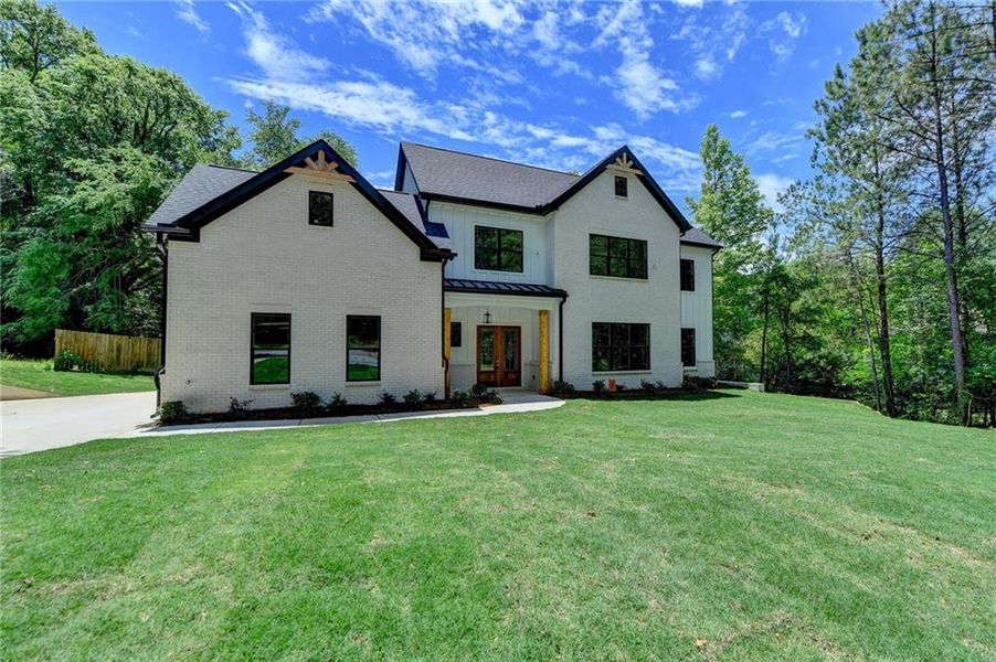 Front exterior of a new home in , Snellville, GA, highlighting curb appeal (Image 25).