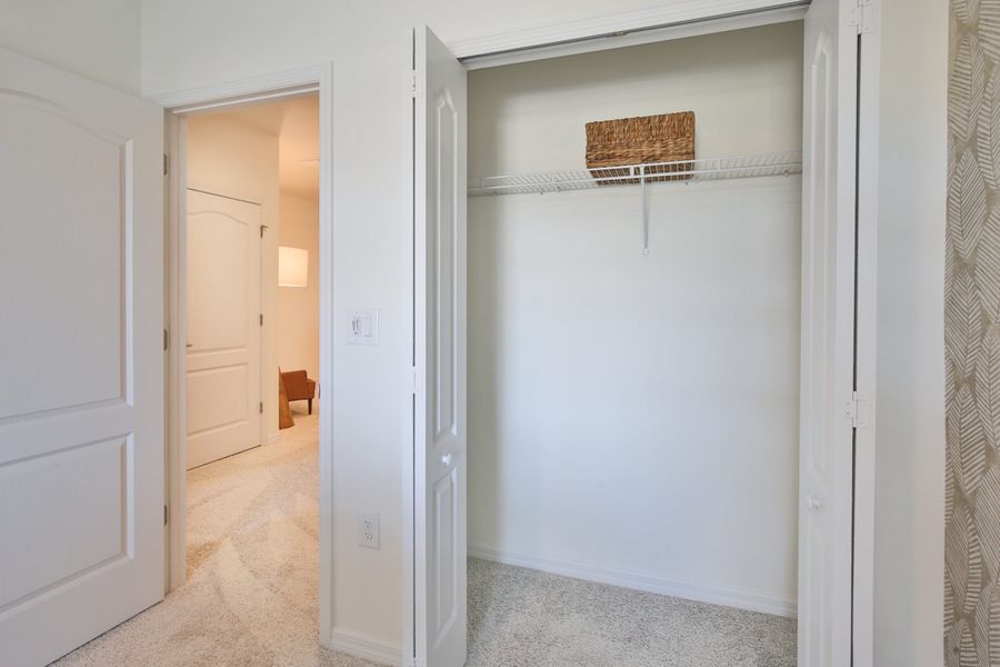 Representative unfurnished interior of a home built from the Morgan by Neal Communities in SkySail, Naples (Image 21).