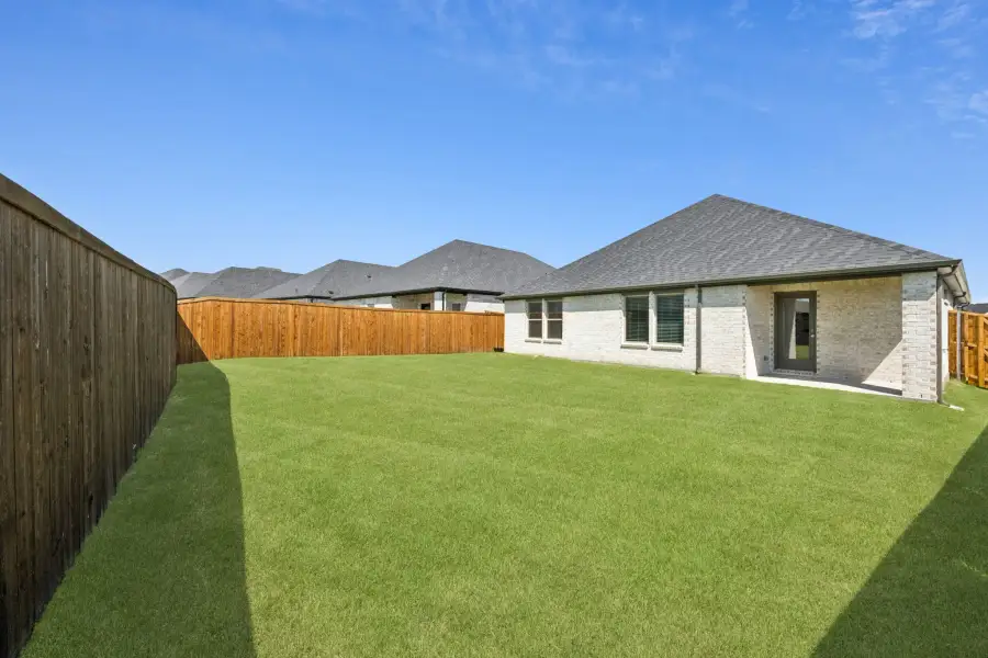 Covered Patio in the Heisman home plan by Trophy Signature Homes – REPRESENTATIVE PHOTO