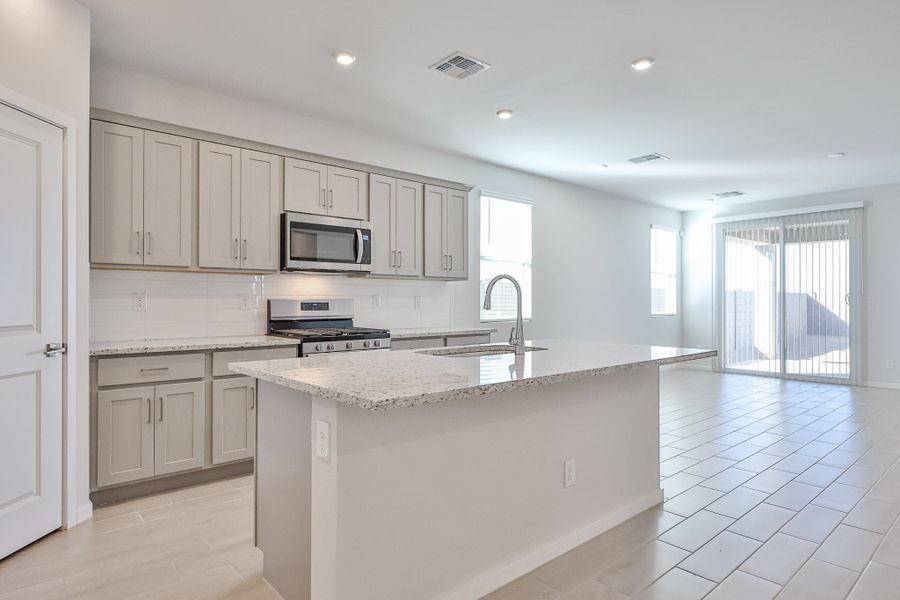 A kitchen with white cabinets. A kitchen with white cabinets.