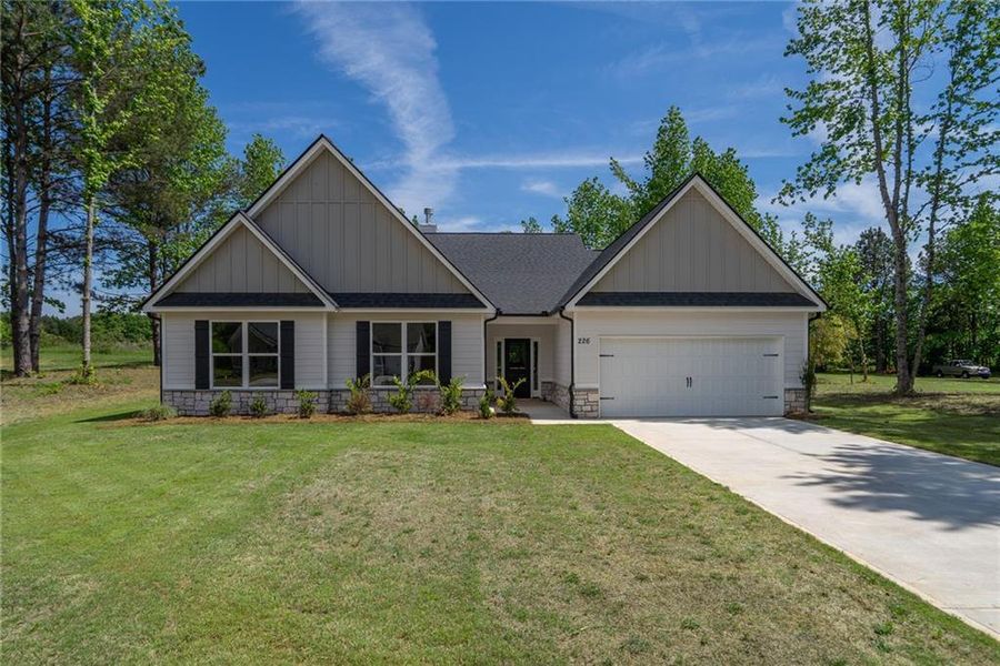 Front exterior of a new home in , Good Hope, GA, highlighting curb appeal (Image 1). Front exterior of a new home in , Good Hope, GA, highlighting curb appeal (Image 1).