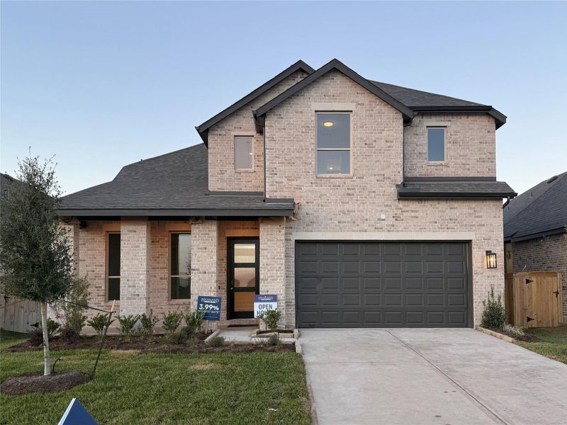 Front exterior of a new home in Emory Glen, Magnolia, TX, highlighting curb appeal (Image 1). Front exterior of a new home in Emory Glen, Magnolia, TX, highlighting curb appeal (Image 1).
