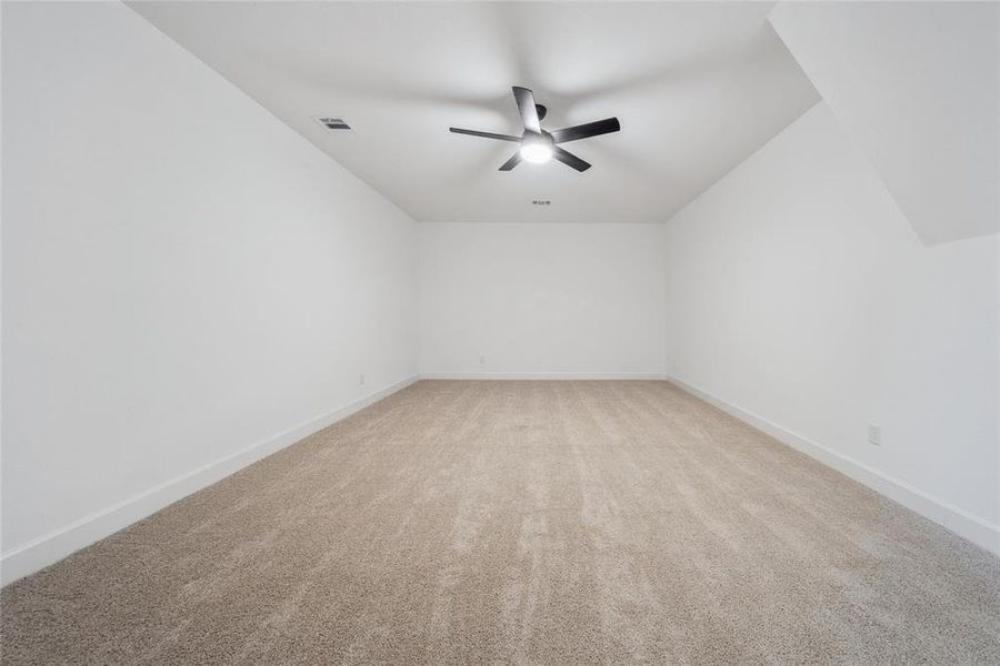 Media/game (2nd floor) room with ceiling fan