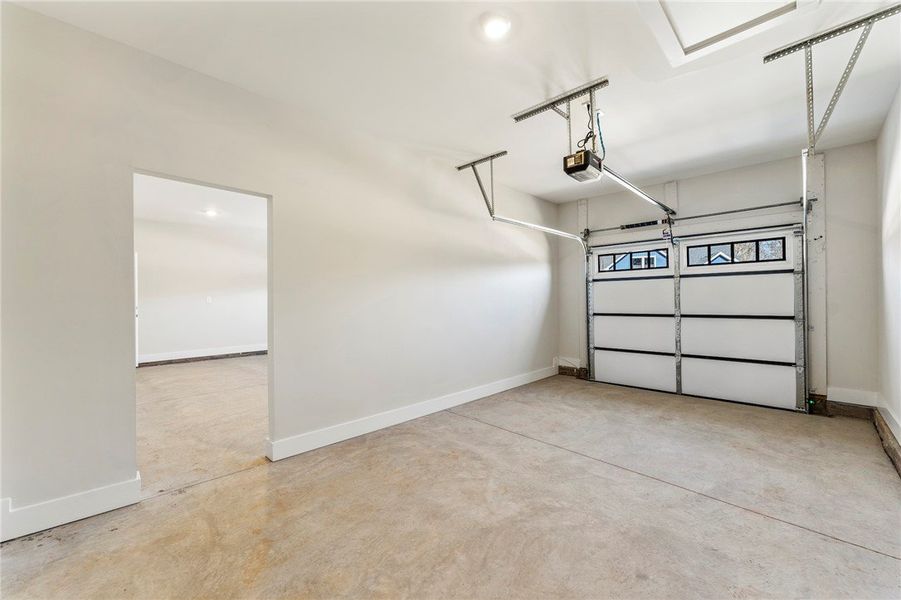 This spacious garage offers ample room for vehicle This spacious garage offers ample room for vehicle