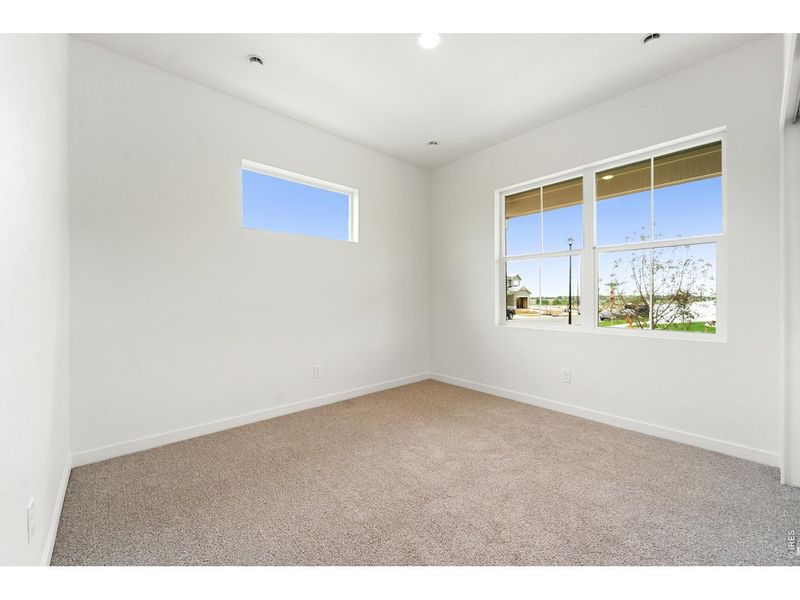 Spacious, unfurnished interior of a new home in Union Colony West, Greeley (Image 11).