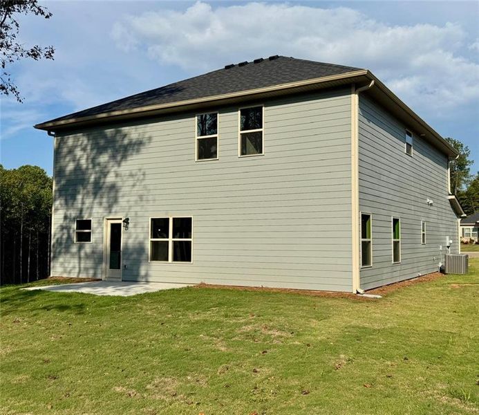 Front exterior of a new home in Magnolia Villas, Cornelia, GA, highlighting curb appeal (Image 2).