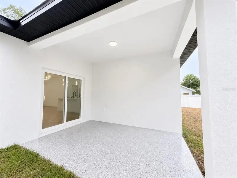 Exterior details and patio area of a home in , Orange City (Image 2). Exterior details and patio area of a home in , Orange City (Image 2).