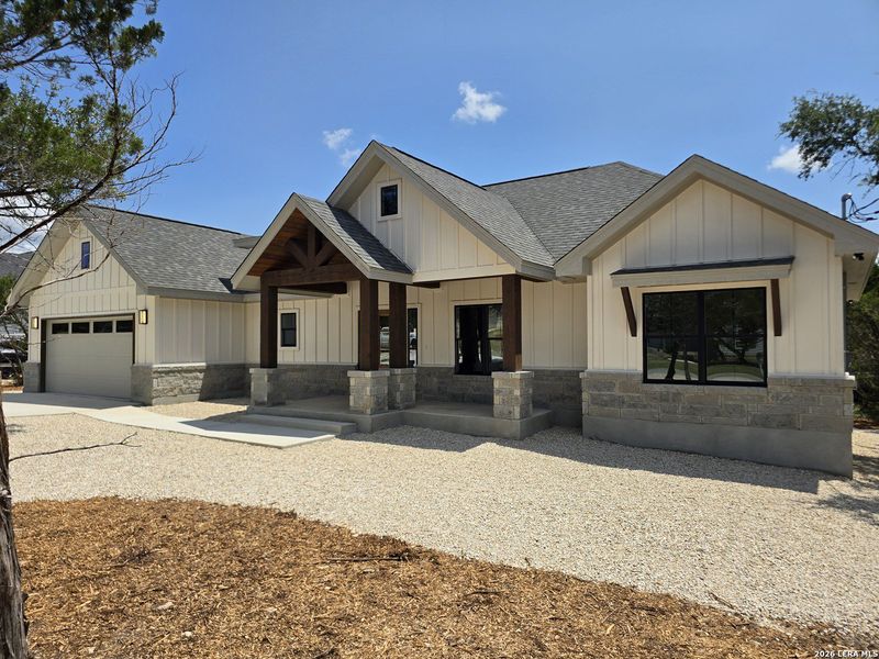Front exterior of a new home in , Canyon Lake, TX, highlighting curb appeal (Image 31).