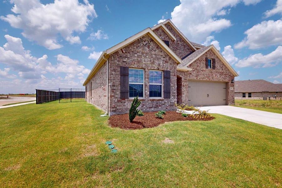 Front exterior of a new home in Prairie Ridge at Goodland, Venus, TX, highlighting curb appeal (Image 21). Front exterior of a new home in Prairie Ridge at Goodland, Venus, TX, highlighting curb appeal (Image 21).