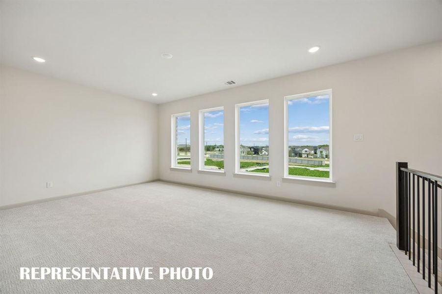 Plenty of family fun time to be had in this light filled game room!  REPRESENTATIVE PHOTO