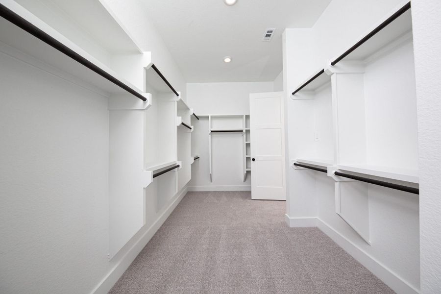 Look at this immaculate closet! With high shelving, multiple rows to hang clothing, you are sure to have enough room for all your belongings!