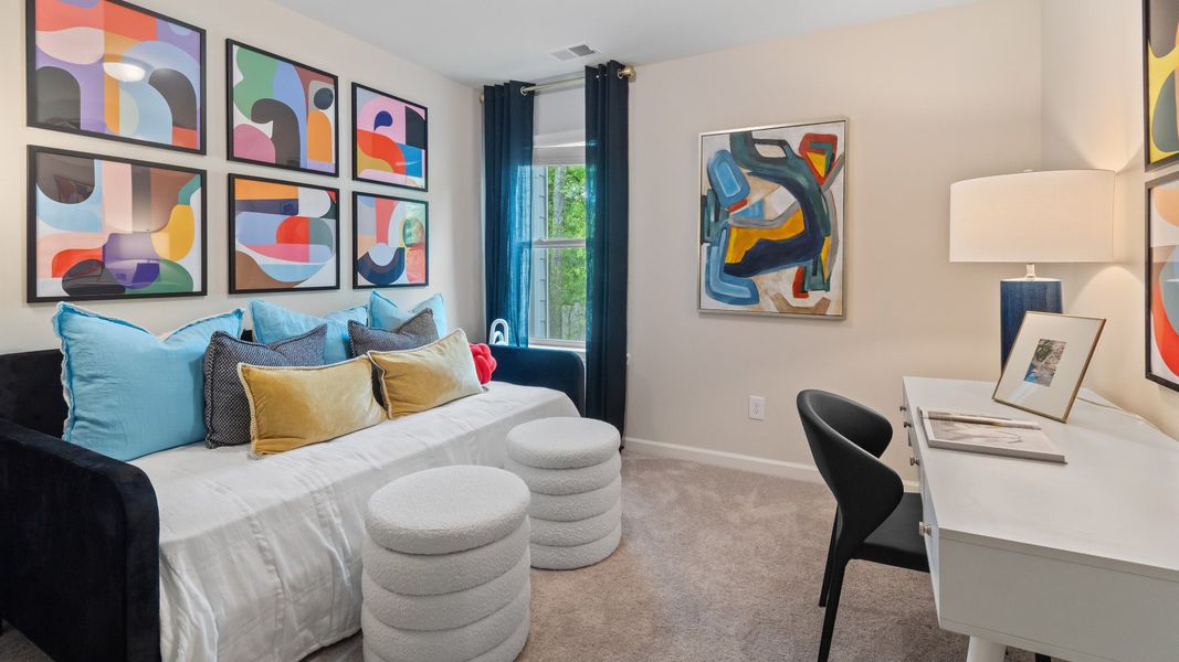 Bedroom with carpet and window