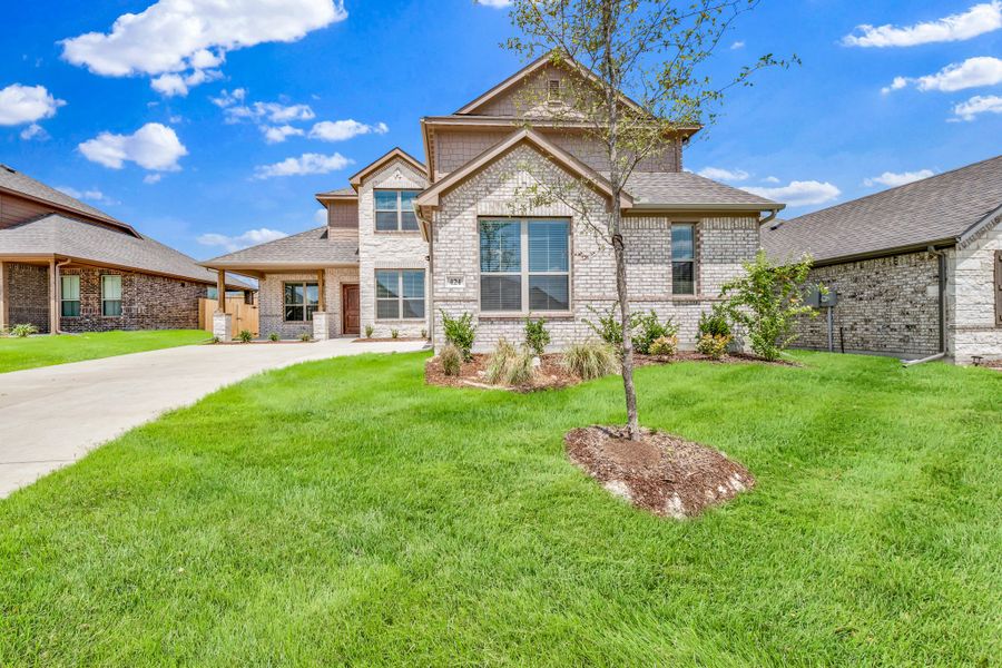 Front exterior of a new home in Summerwood, Red Oak, TX, highlighting curb appeal (Image 25). Front exterior of a new home in Summerwood, Red Oak, TX, highlighting curb appeal (Image 25).