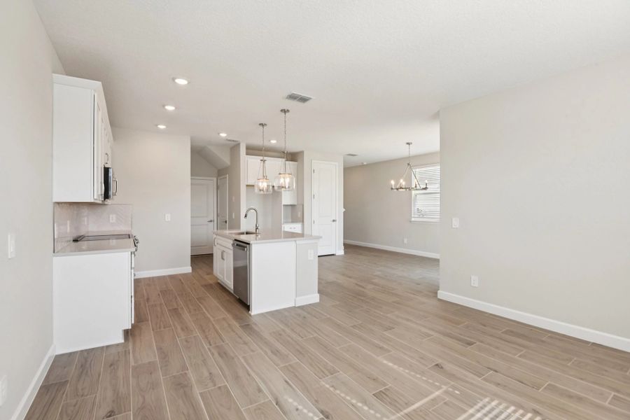 Family room space is located off the kitchen and opens up into the dining space as well