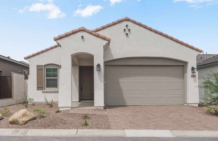 Front exterior of a new home in Regent Hills - Meadow Series, Buckeye, AZ, highlighting curb appeal (Image 2). Front exterior of a new home in Regent Hills - Meadow Series, Buckeye, AZ, highlighting curb appeal (Image 2).