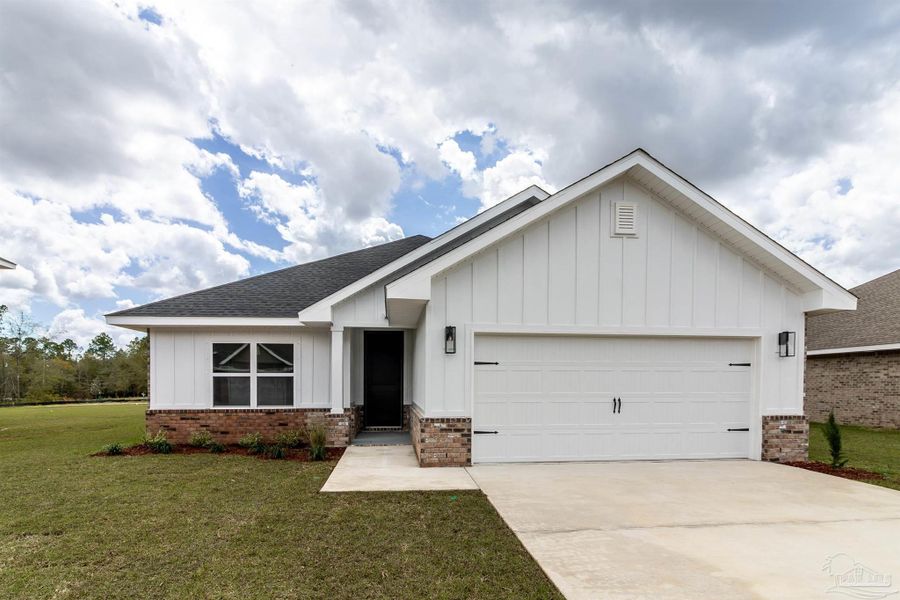 Front exterior of a new home in Parkland Place, Pace, FL, highlighting curb appeal (Image 1). Front exterior of a new home in Parkland Place, Pace, FL, highlighting curb appeal (Image 1).