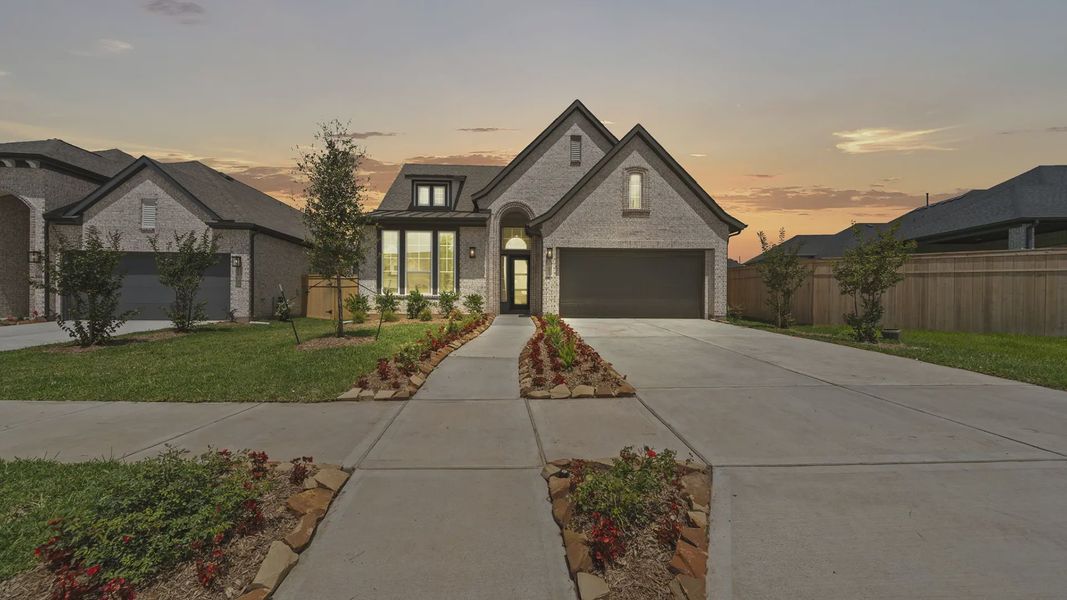 Front exterior of a new home in Sienna 45', Missouri City, TX, highlighting curb appeal (Image 20).