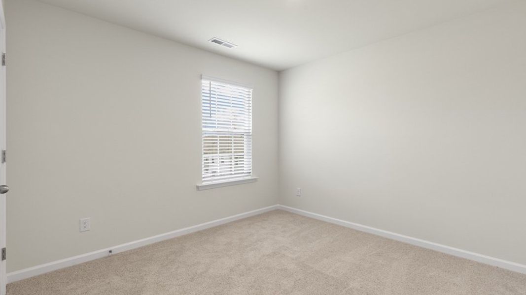 Spacious, unfurnished interior of a new home in The Grove at Matthews Landing, Fuquay Varina (Image 23).