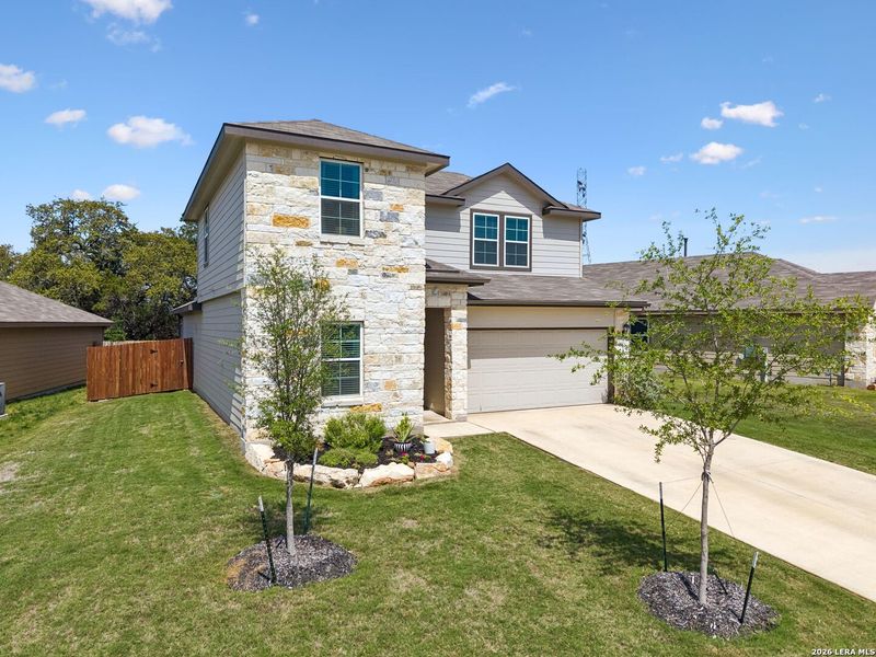 Front exterior of a new home in Brookstone Creek, San Antonio, TX, highlighting curb appeal (Image 22).