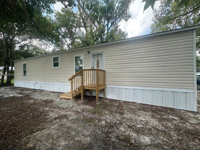 Exterior details and patio area of a home in , Lake City (Image 12).