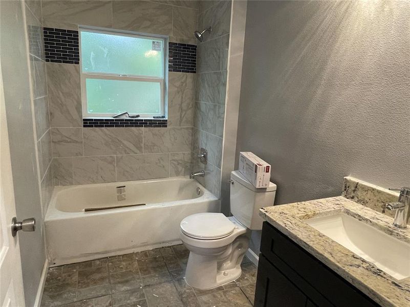 Upgraded tile and tile accents in both bathrooms