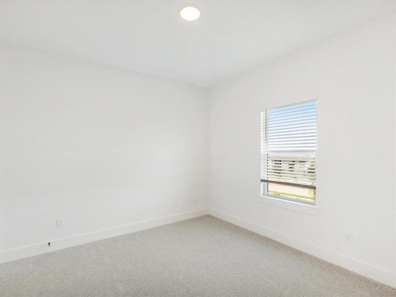 Spacious, unfurnished interior of a new home in Royal Court, Little Elm (Image 24).