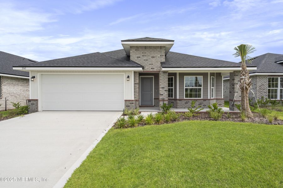 Front exterior of a new home in Shadow Crest at Rolling Hills, Green Cove Springs, FL, highlighting curb appeal (Image 14).
