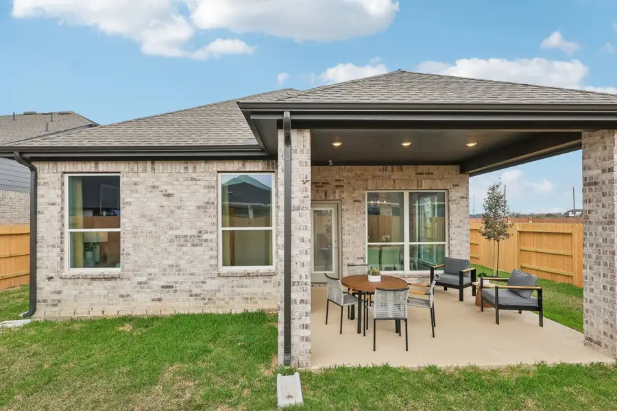 Exterior details and patio area of a home in Sunterra, Katy (Image 4).