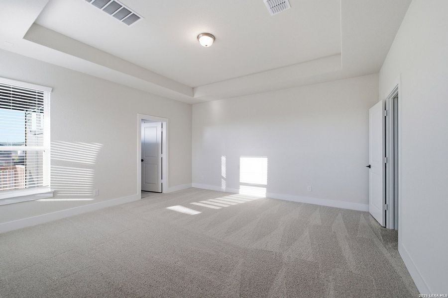 Spacious, unfurnished interior of a new home in The Woodlands at Medina Hills, Mico (Image 34).