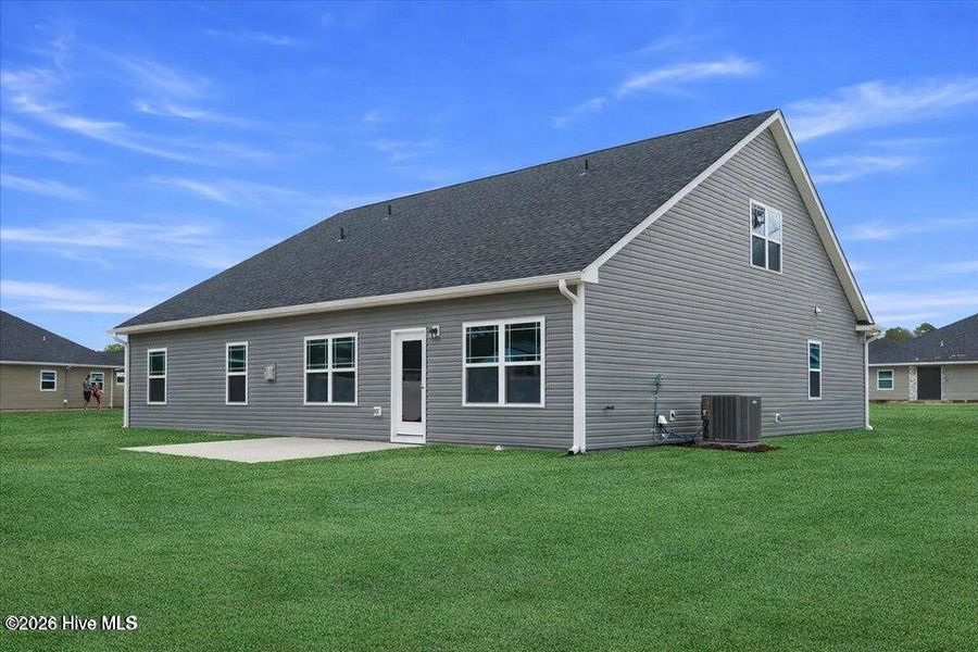Exterior details and patio area of a home in Wood Creek Landing, Leland (Image 25).