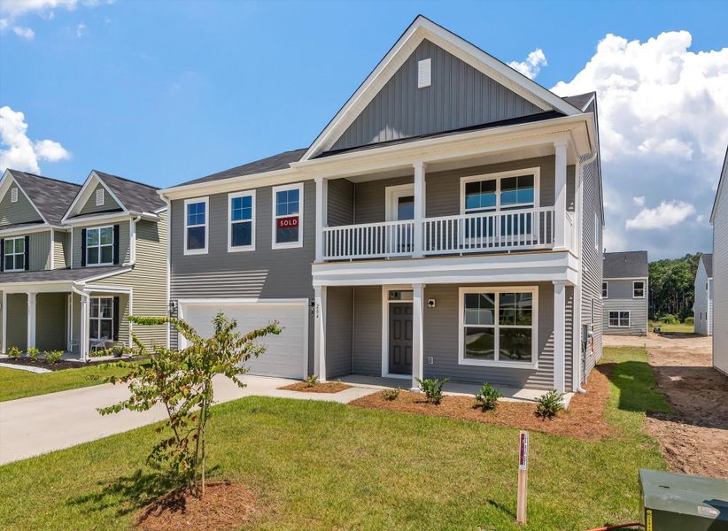 Front exterior of a new home in Oakley Pointe, Moncks Corner, SC, highlighting curb appeal (Image 2).