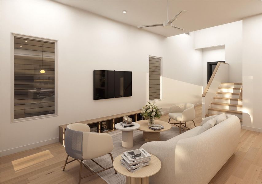 Tall ceilings at the entry that lead into the main living space — light pouring down the stair run