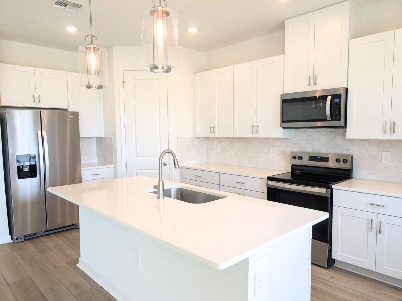 Furnished interior view inside a new home in Coasterra - Reserve Series, Palmetto (Image 7).