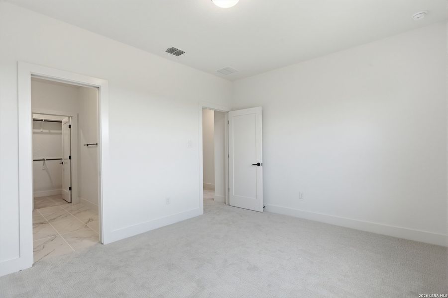 Spacious, unfurnished interior of a new home in Enchanted Bluff, San Antonio (Image 26).