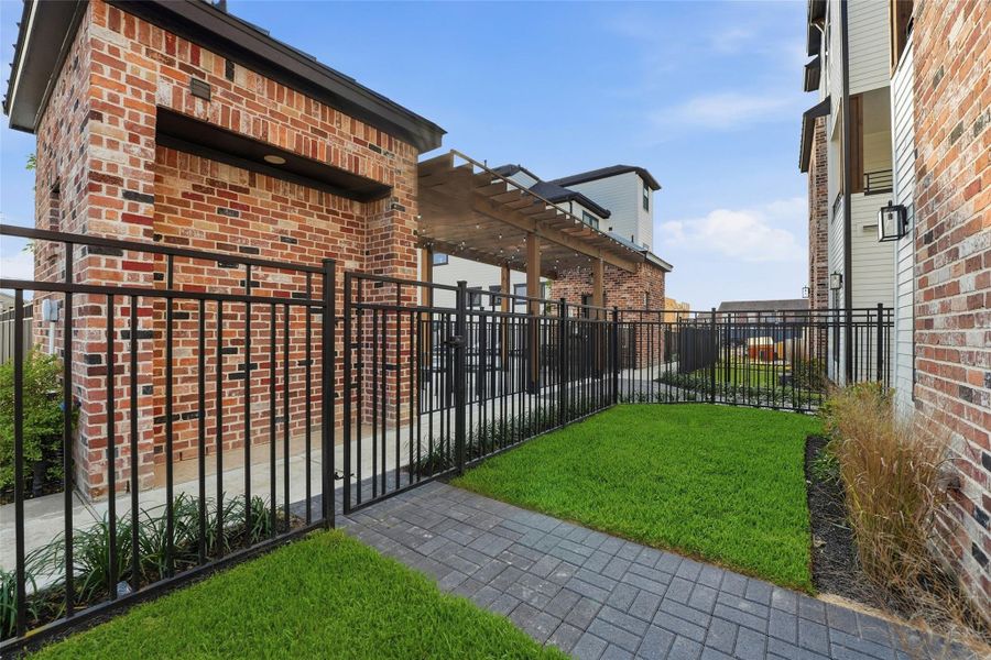 Exterior details and patio area of a home in Uptown District, Houston (Image 21).
