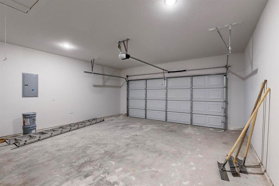 Garage with a garage door opener and electric panel