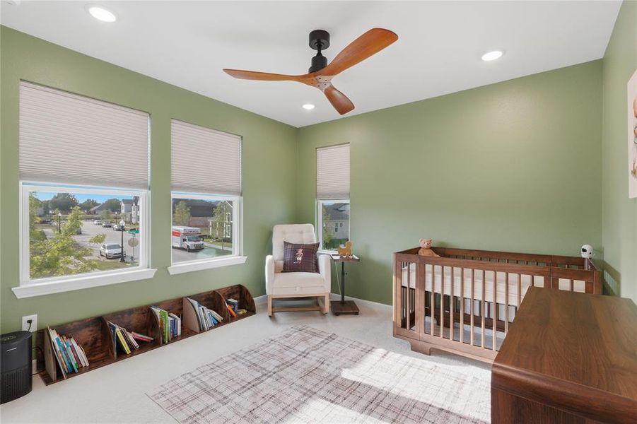 Room with recessed lighting, a ceiling fan with wooden blades, and light green painted walls Room with recessed lighting, a ceiling fan with wooden blades, and light green painted walls