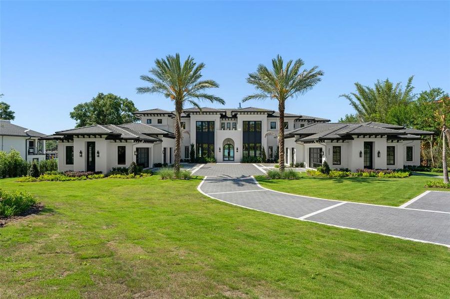 Front exterior of a new home in , Windermere, FL, highlighting curb appeal (Image 28).