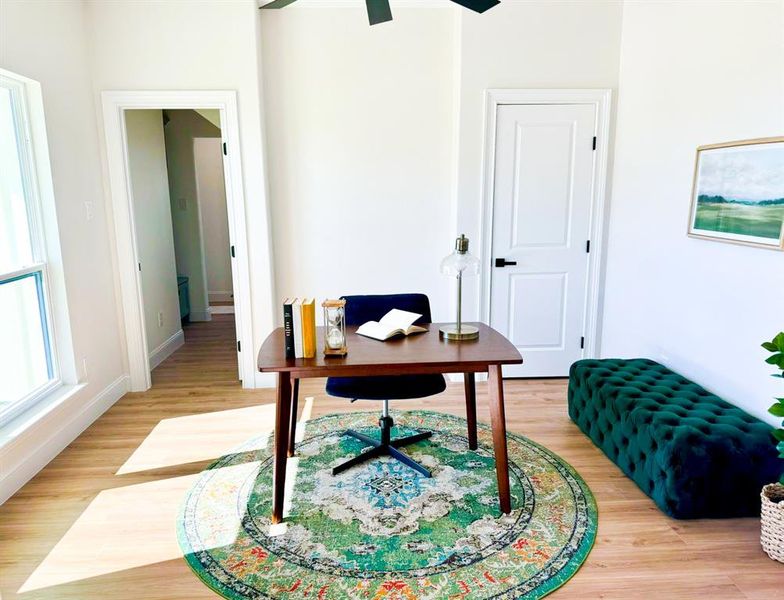 Office area with hardwood / wood-style floors