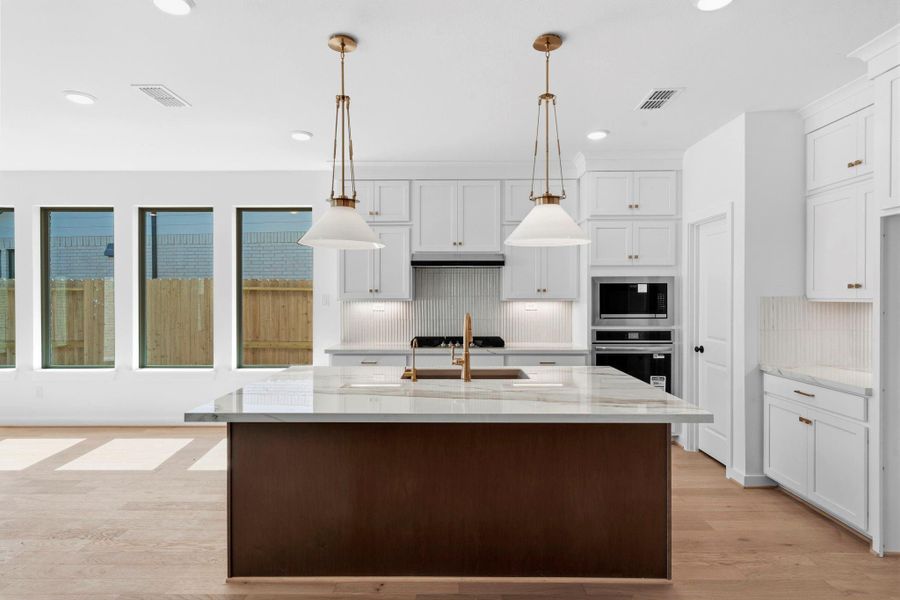 Stacked Cabinets, & Built In Appliances Bring the Chef's Kitchen to Life