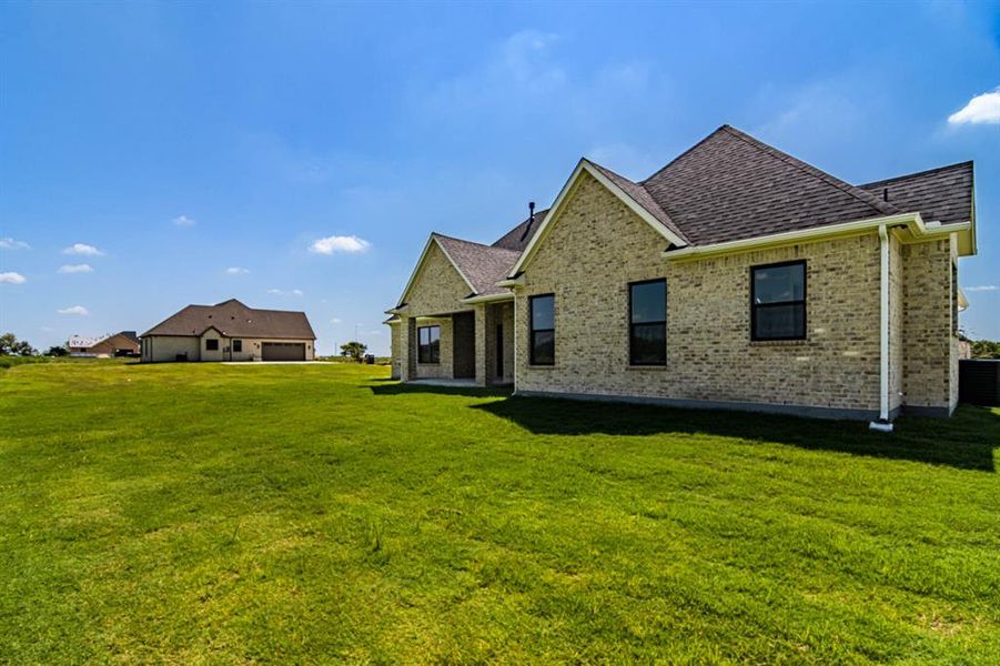Front exterior of a new home in , Caddo Mills, TX, highlighting curb appeal (Image 20). Front exterior of a new home in , Caddo Mills, TX, highlighting curb appeal (Image 20).